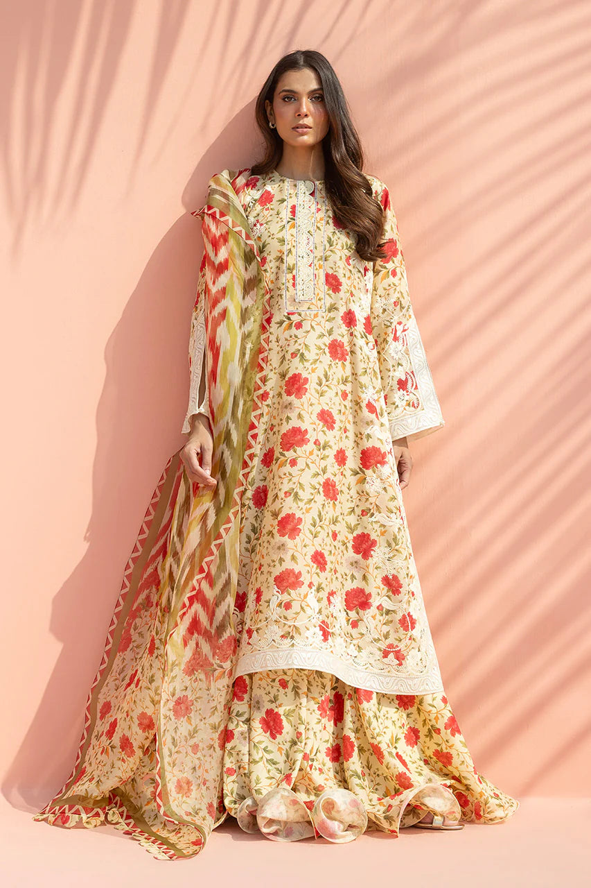 Woman wearing a floral dress with a pink background