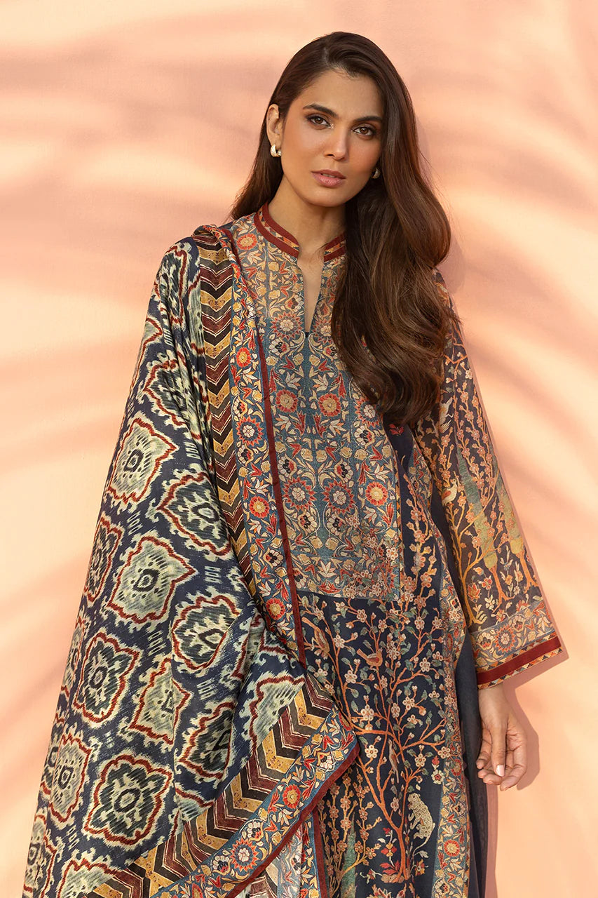 Woman wearing a patterned outfit against a pink background