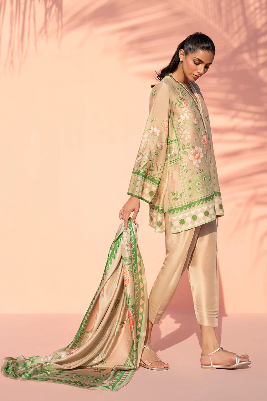 Woman in a traditional outfit with floral patterns against a pink background