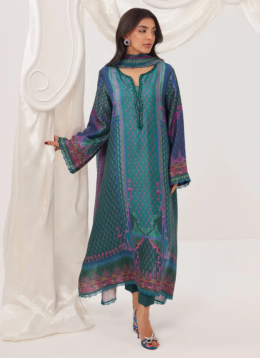 Woman wearing a colorful traditional outfit with a white curtain background