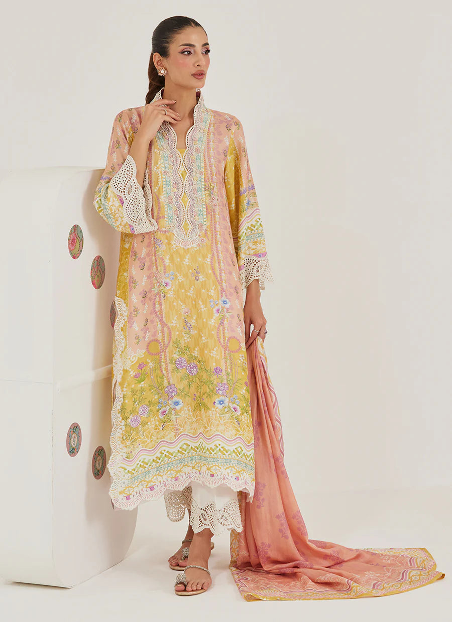 Woman wearing a yellow and pink embroidered outfit with a matching dupatta on a white background