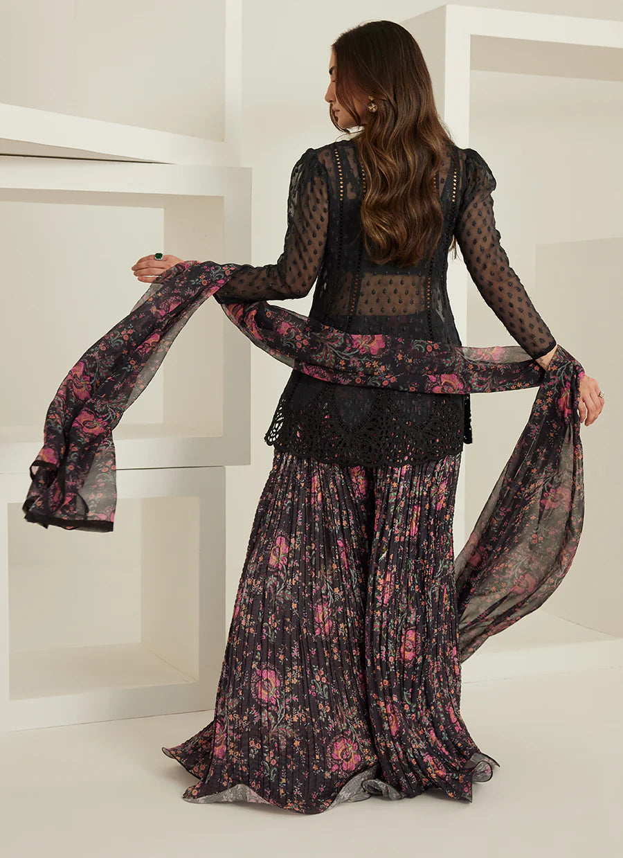 Woman holding a floral scarf in a minimalistic setting