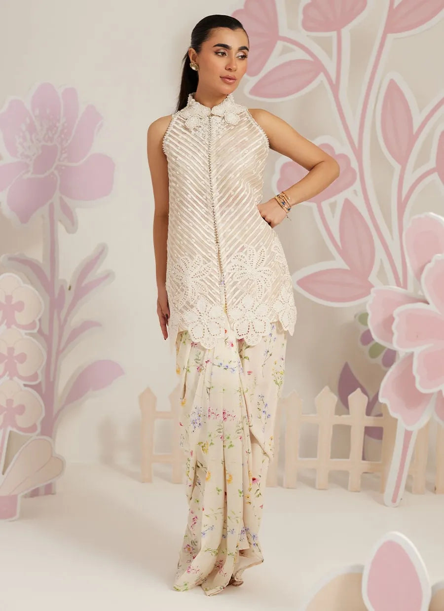 Woman wearing a floral dress with a decorative background