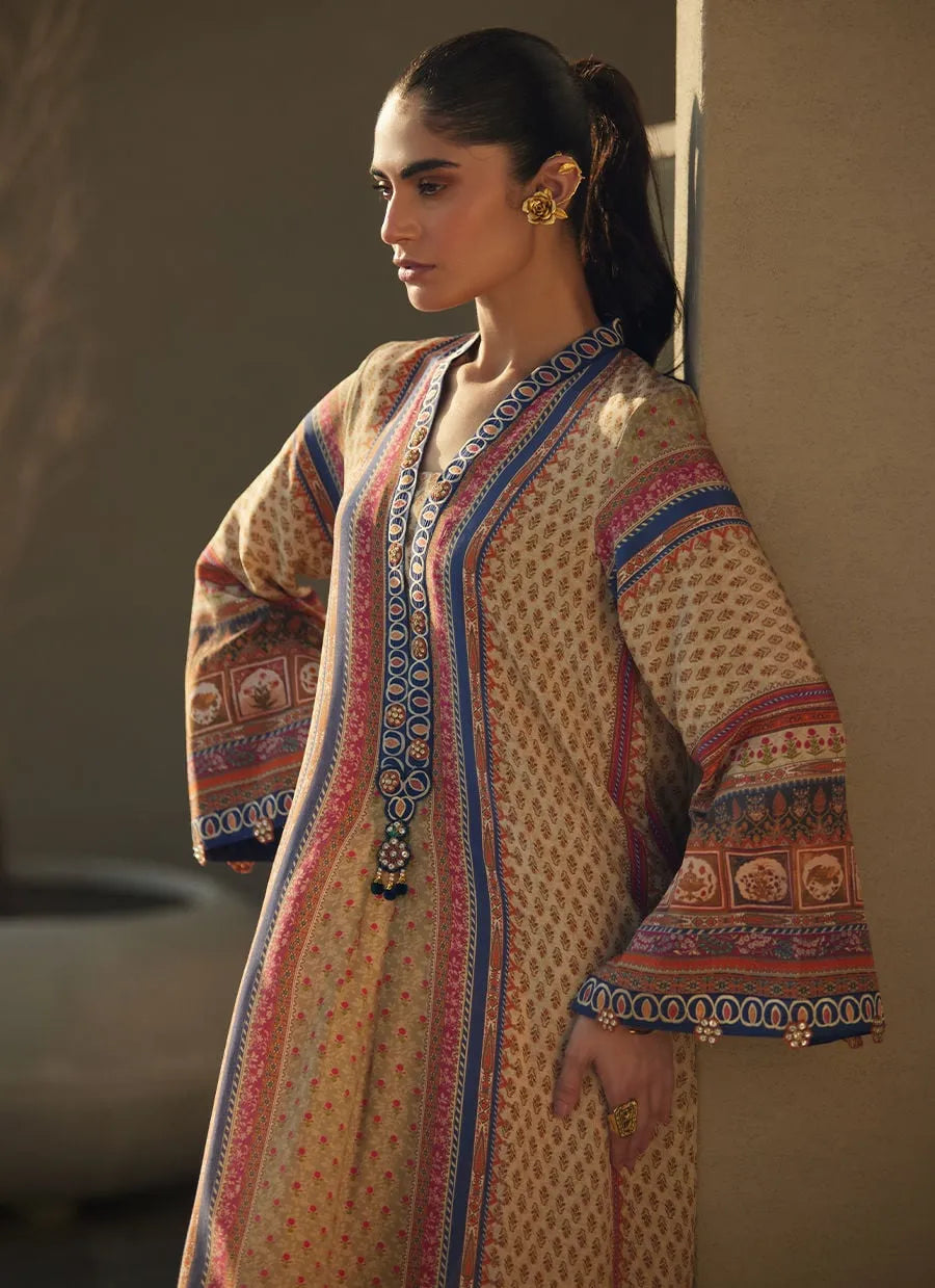 Woman wearing a patterned dress with a neutral background