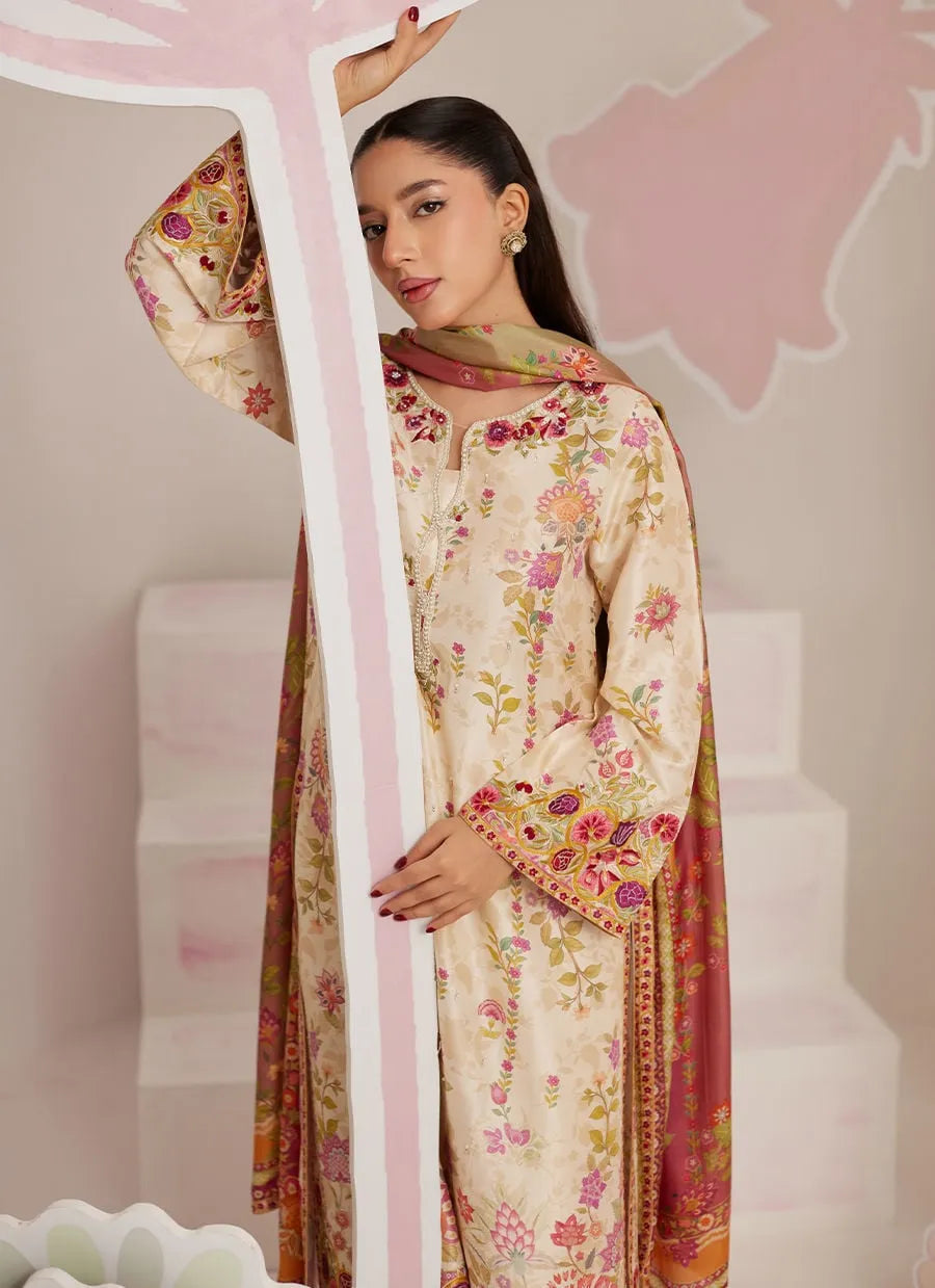 Woman wearing a traditional outfit with floral patterns in a minimalistic setting