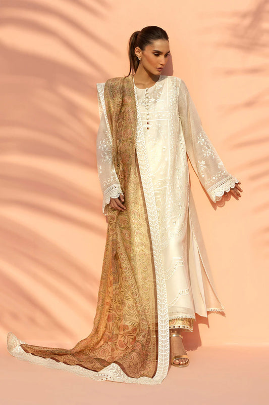 Woman wearing a traditional outfit with a beige and gold dupatta on a peach background