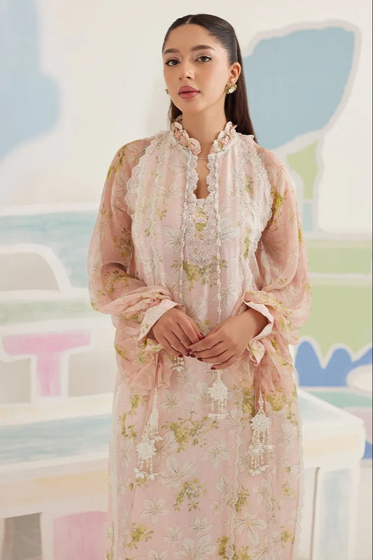 Woman wearing a pink floral dress with a matching scarf in a colorful, abstract setting