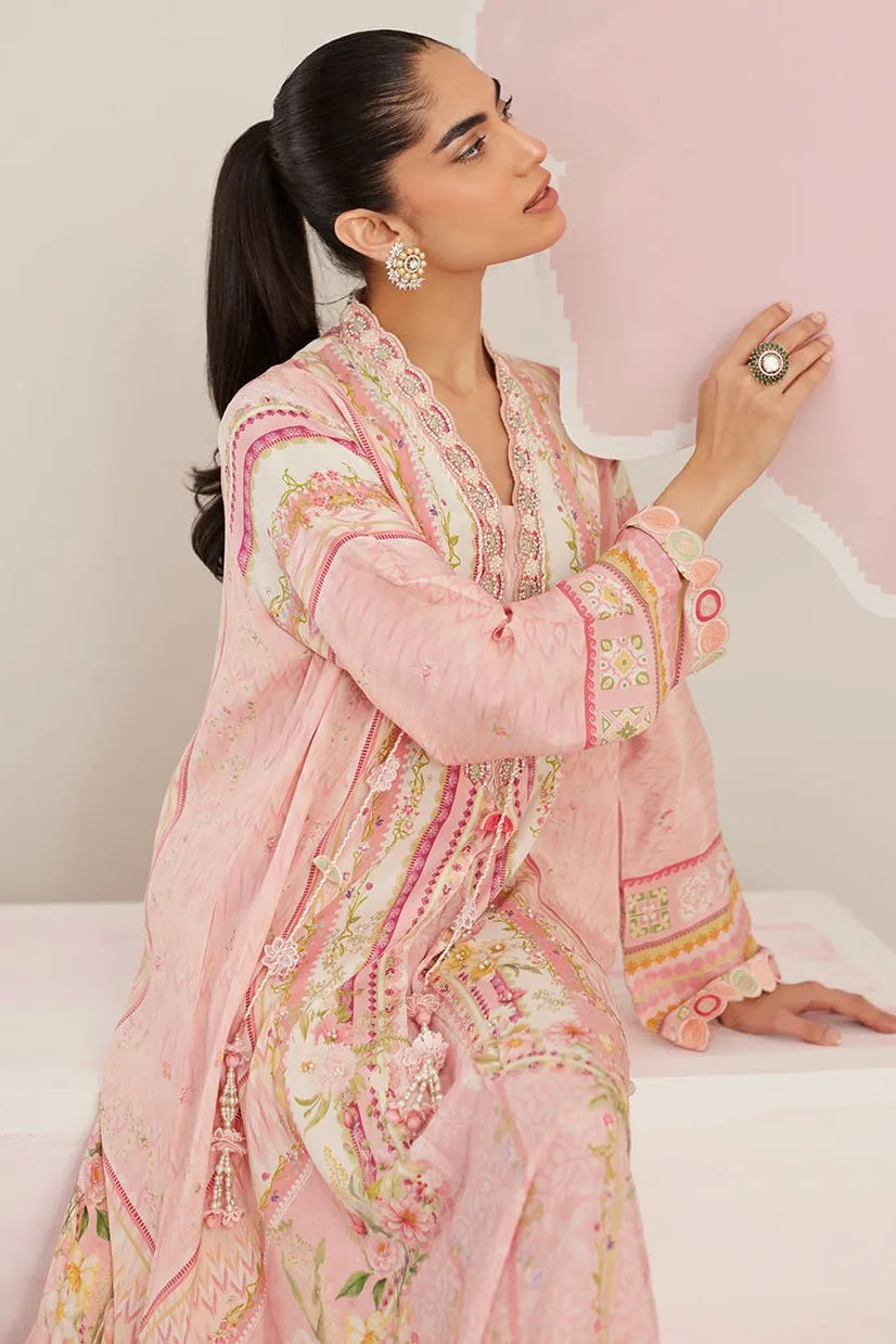 Woman wearing a pink floral outfit against a light background