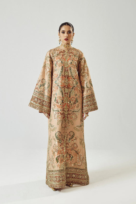 Woman wearing a patterned dress on a white background