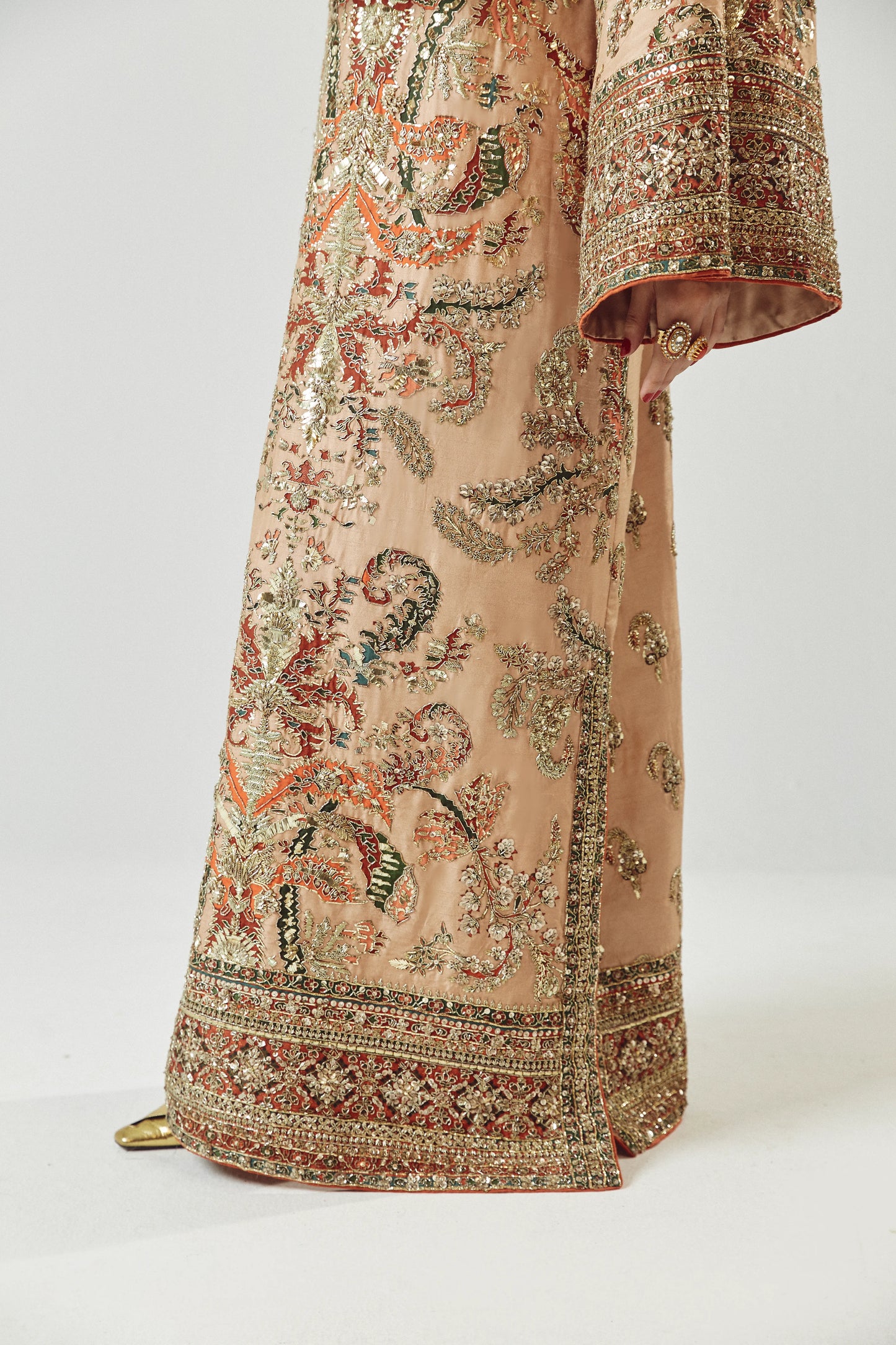Elegant embroidered garment on a white background