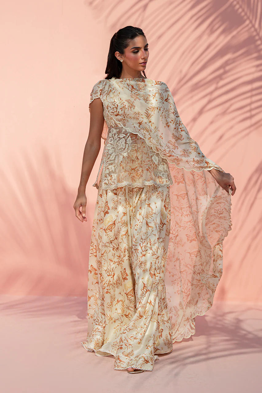 Woman wearing a floral dress against a pink background