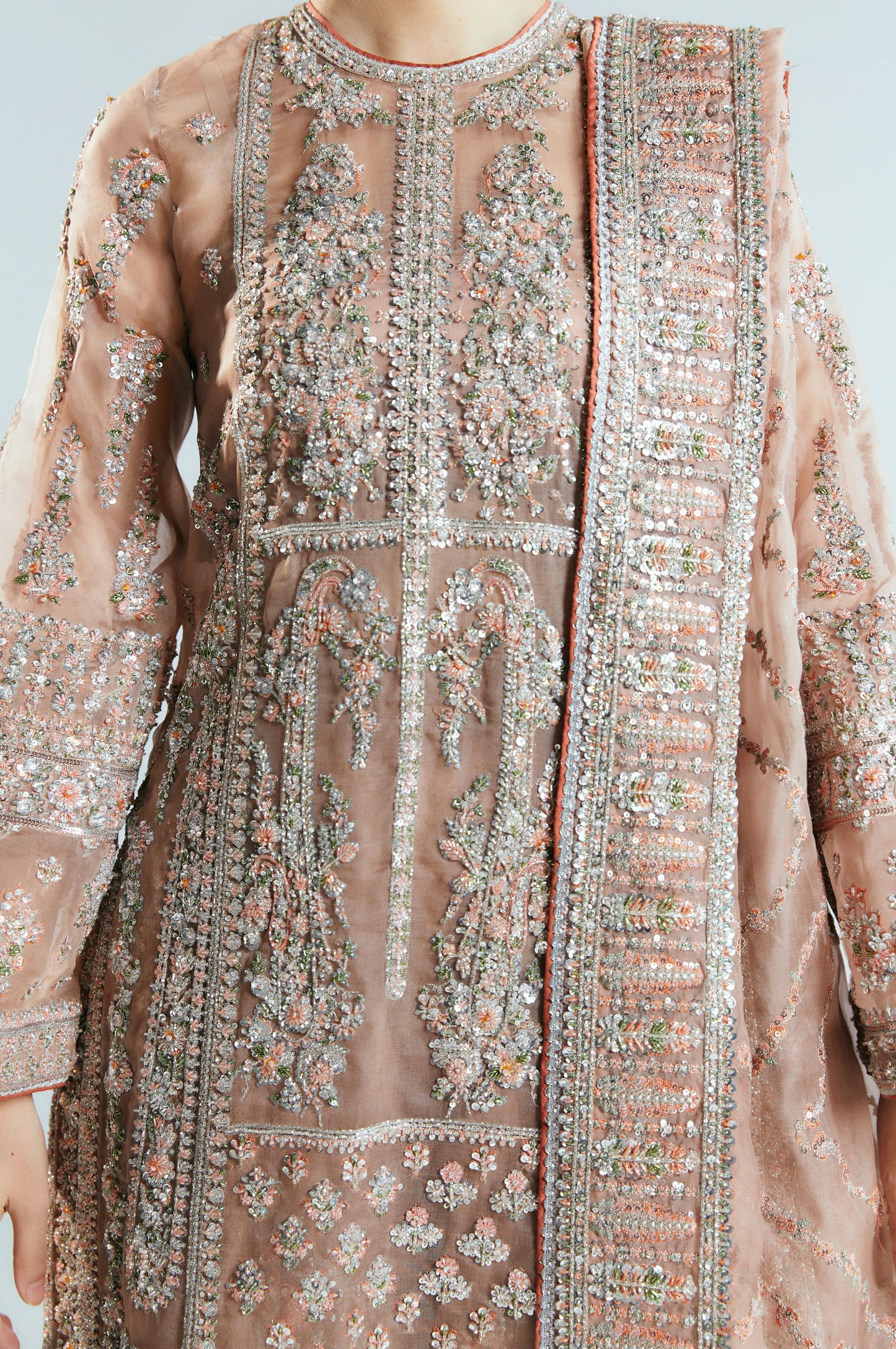 Decorative traditional outfit with intricate embroidery and embellishments.