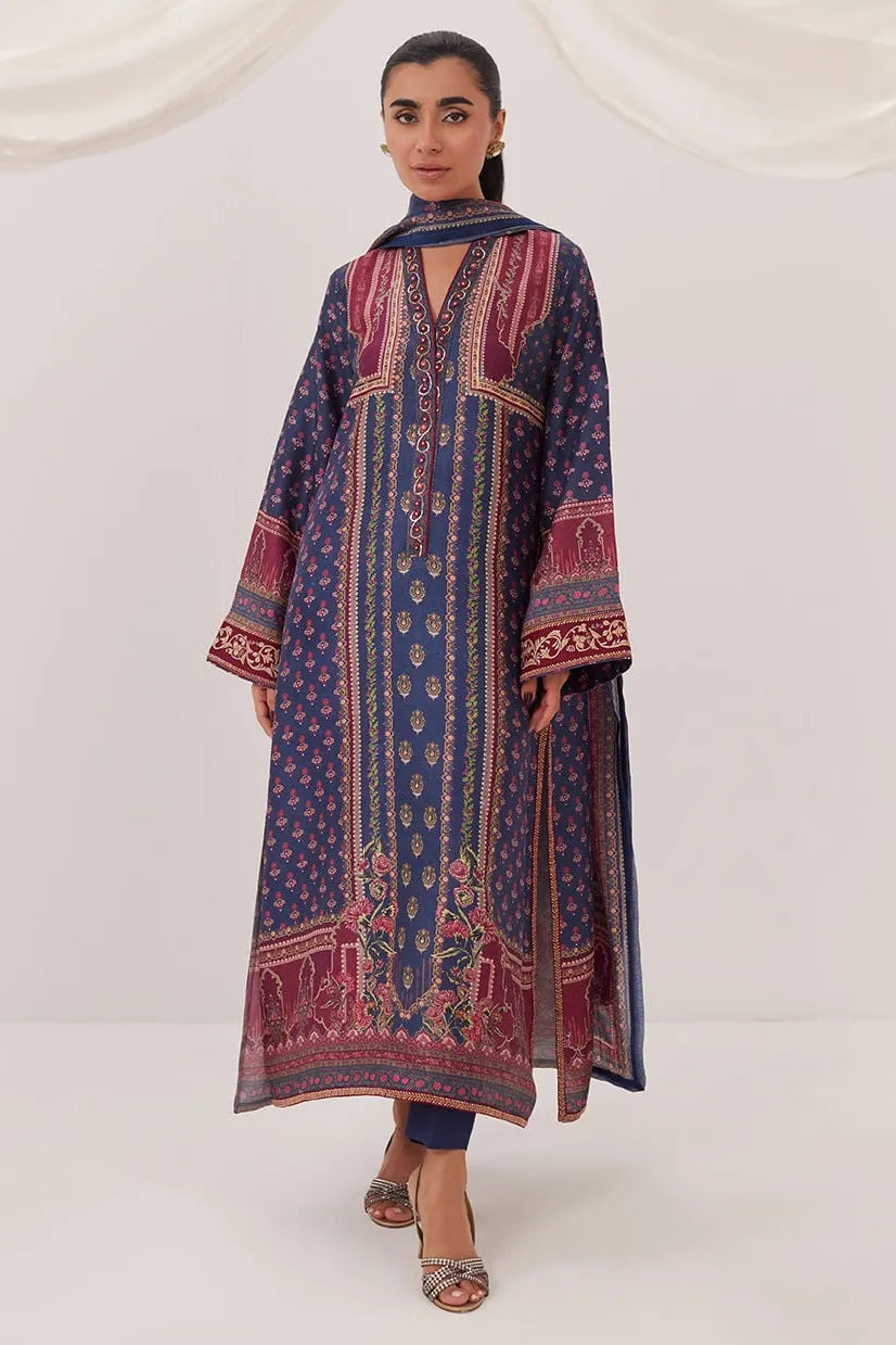 Woman wearing a patterned dress on a white background