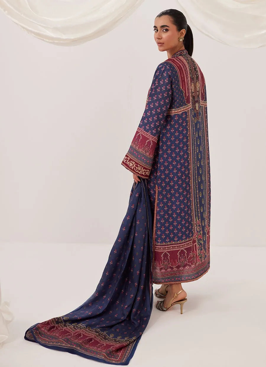 Woman wearing a traditional embroidered outfit on a white background