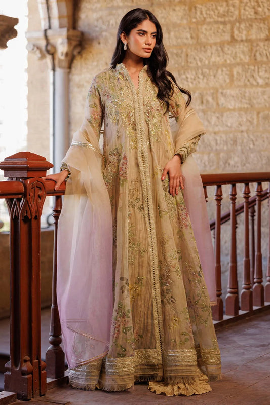 Woman in a traditional outfit standing in an elegant interior setting.