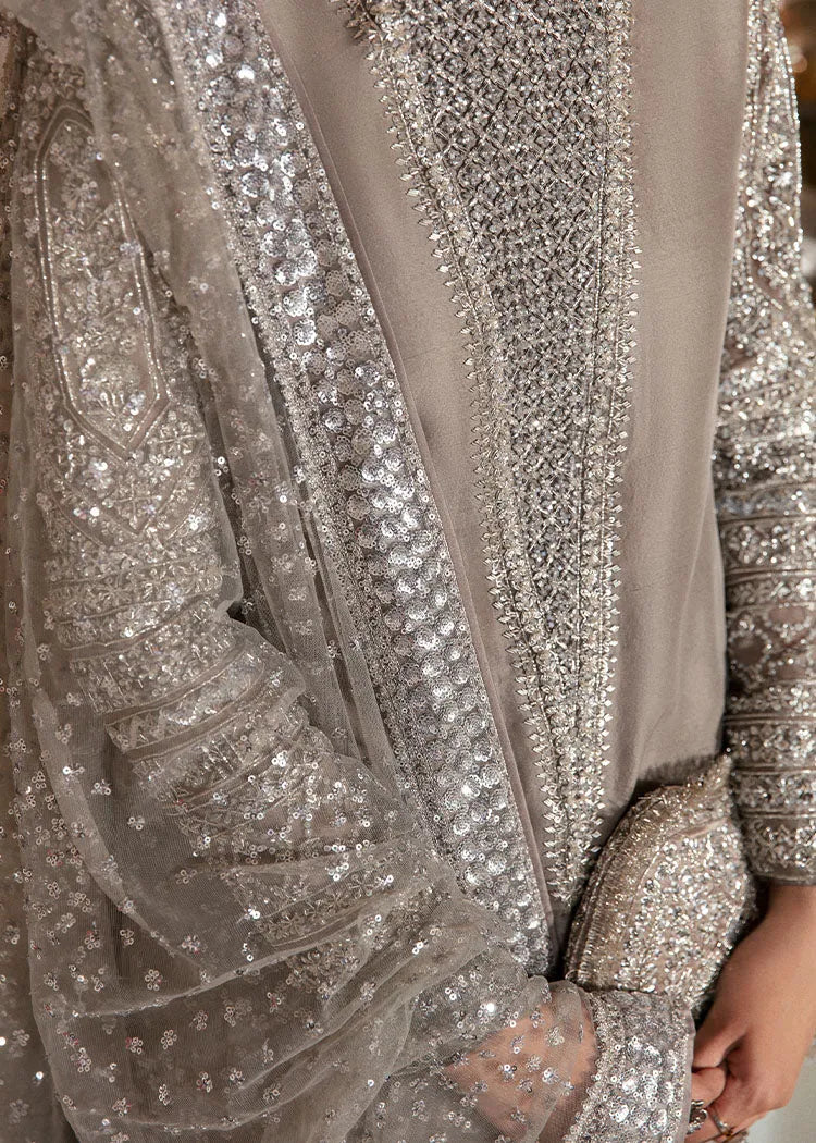 Close-up of a silver sequin dress with intricate detailing.