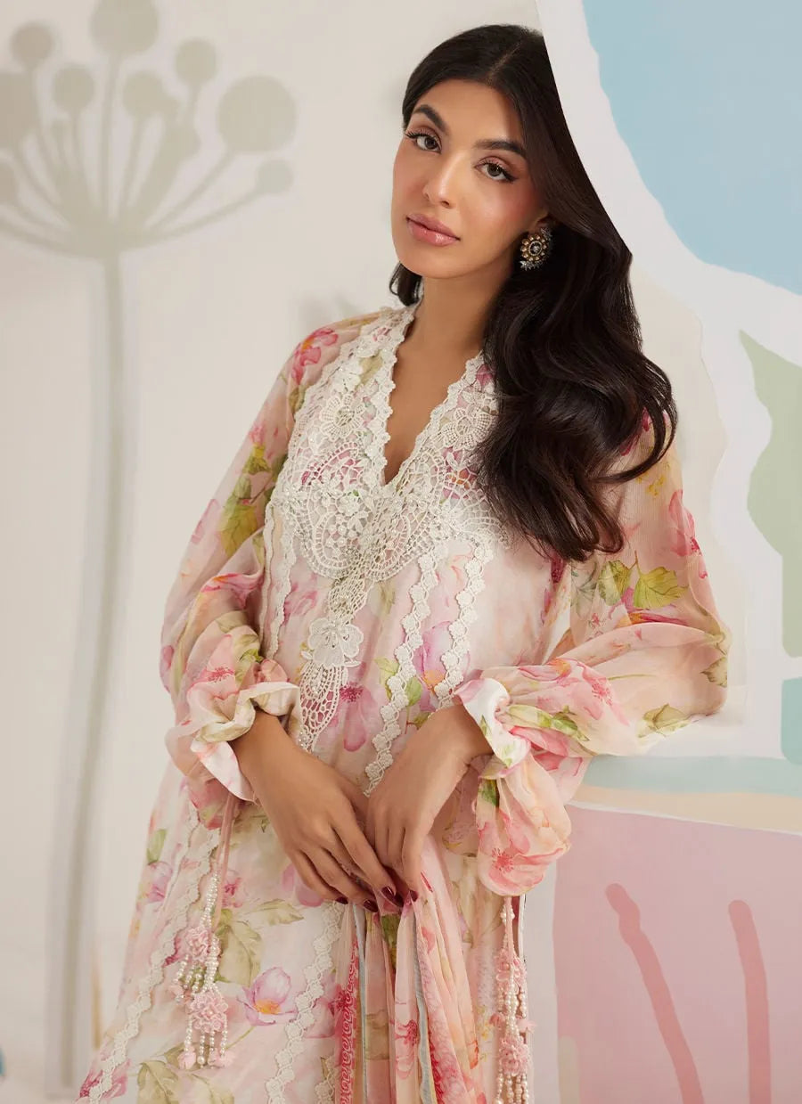 Woman wearing a floral dress with lace details in a decorative setting