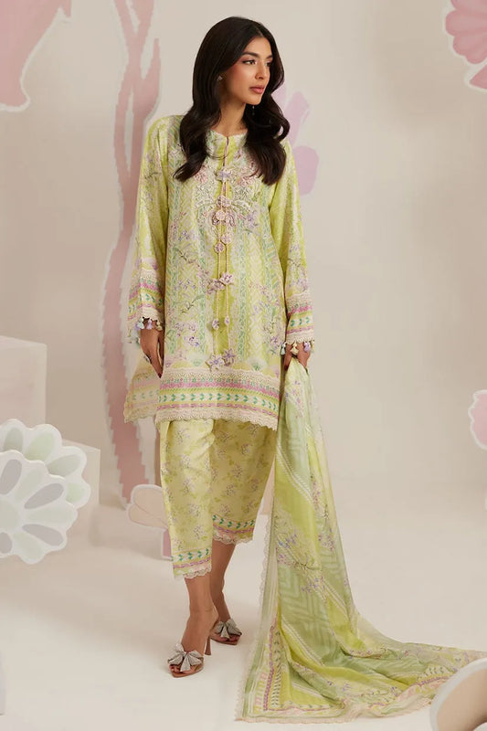 Woman wearing a light green traditional outfit with a matching dupatta on a white background