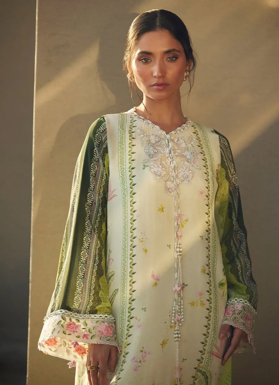 Woman wearing a traditional embroidered outfit with floral patterns