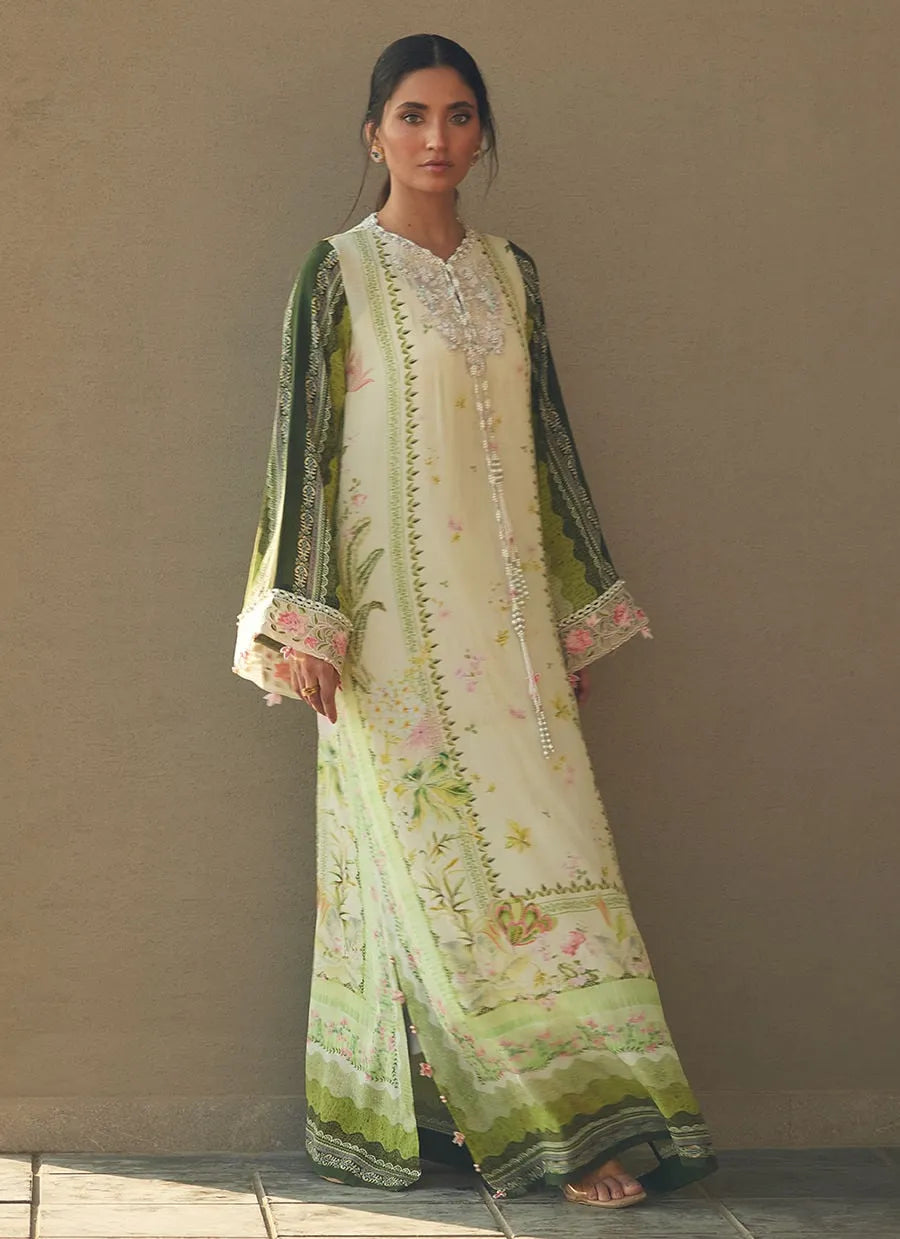 Woman wearing a traditional embroidered outfit with a neutral background