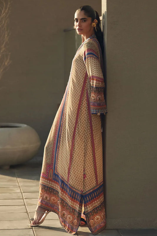 Woman wearing a patterned dress leaning against a wall outdoors.