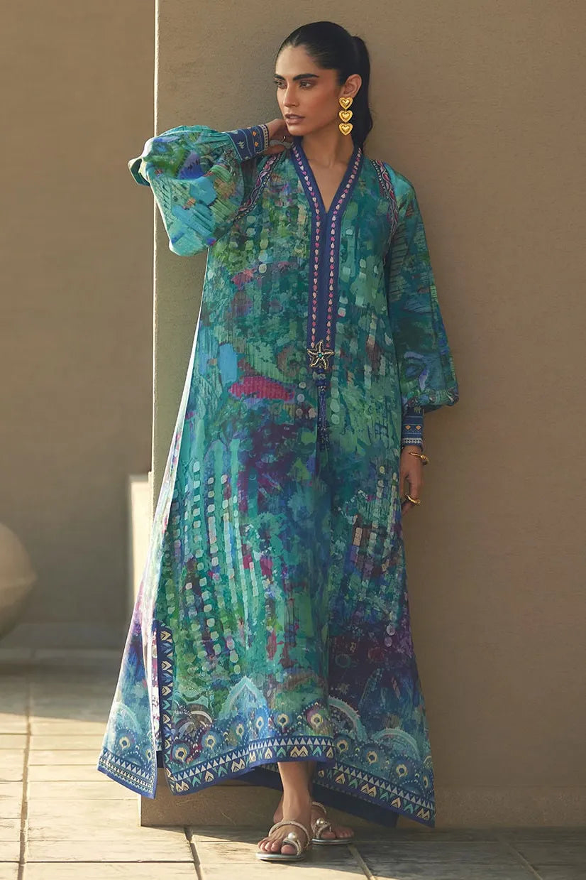Woman wearing a colorful patterned dress against a neutral background