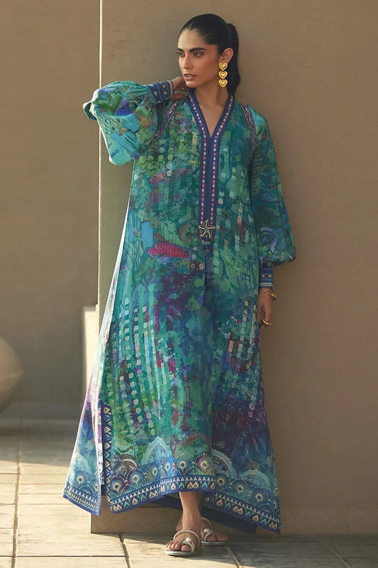 Woman wearing a colorful patterned dress against a neutral background