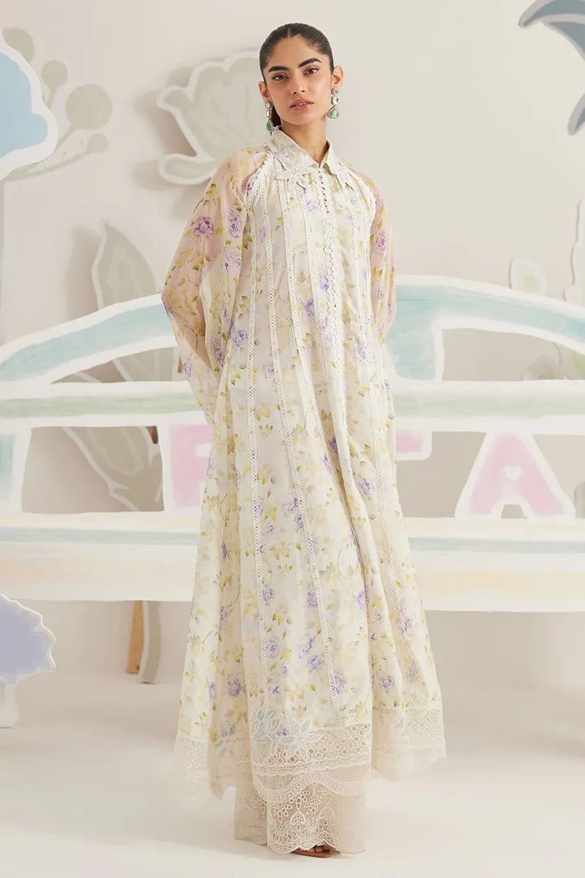 Woman wearing a floral dress with a matching dupatta against a light background